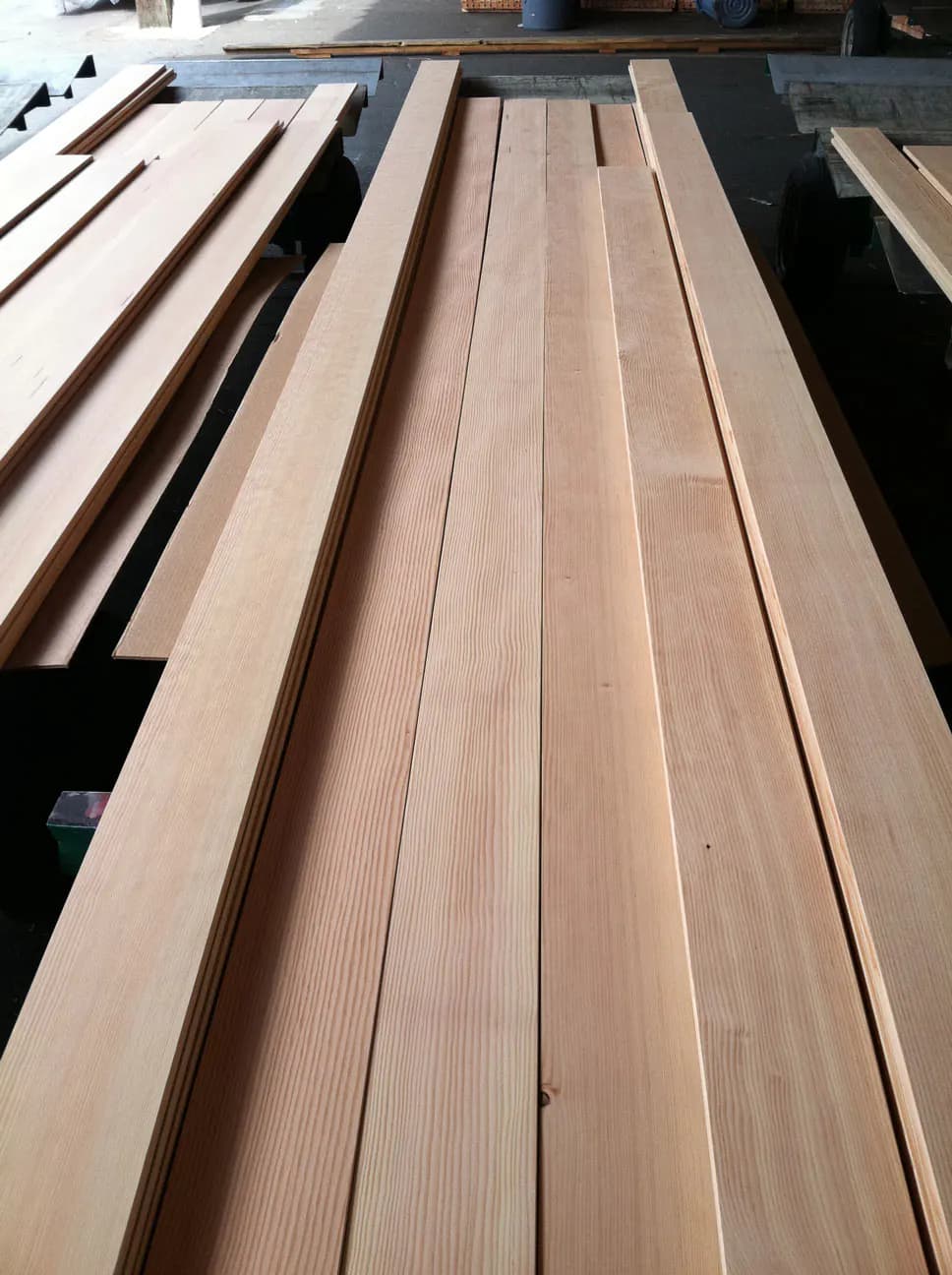 Clear vertical-grain Douglas fir boards laid out in a mill