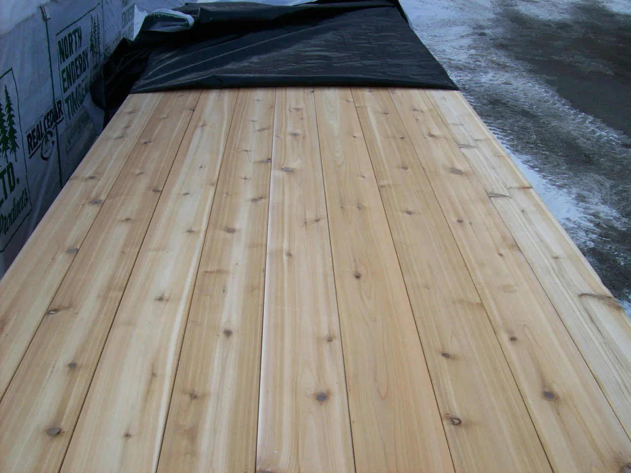 Face of stacked inland red cedar boards showing tight knots
