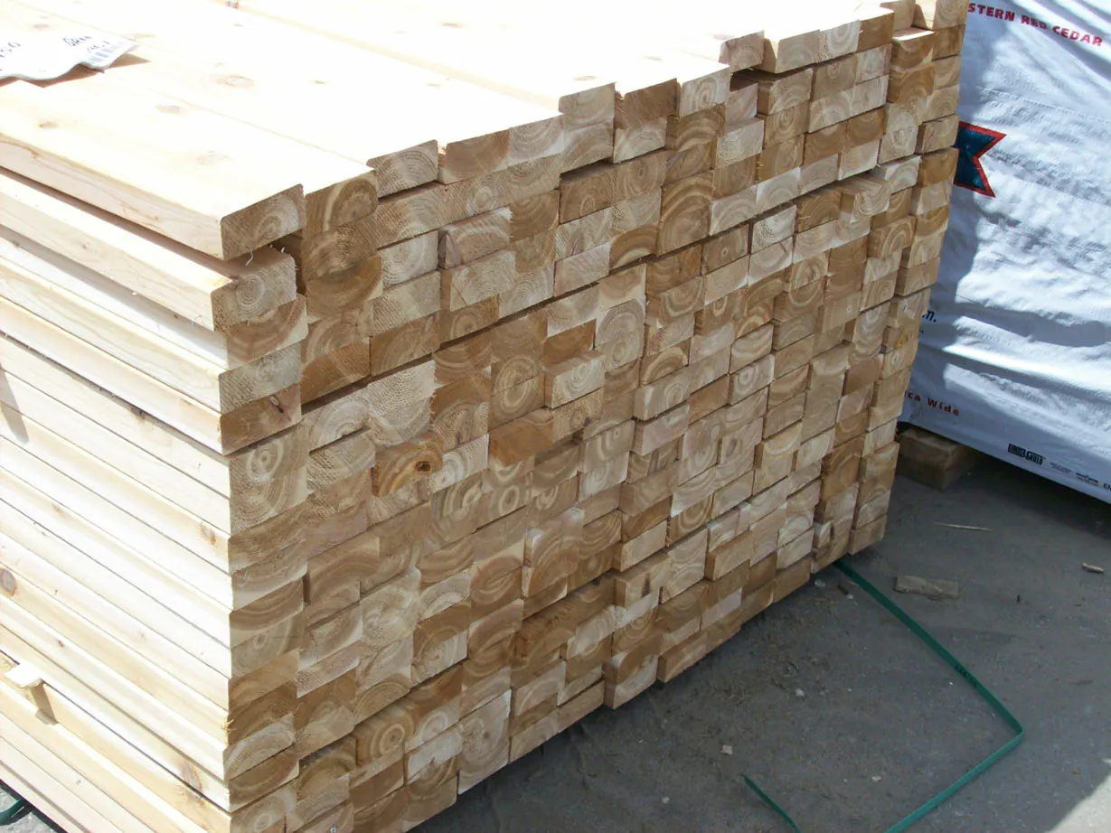 Stacked inland red cedar boards viewed from one corner