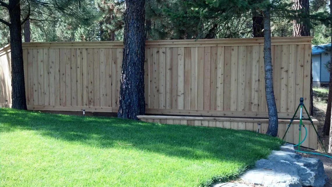 Finished western red cedar fence with vertical boards
