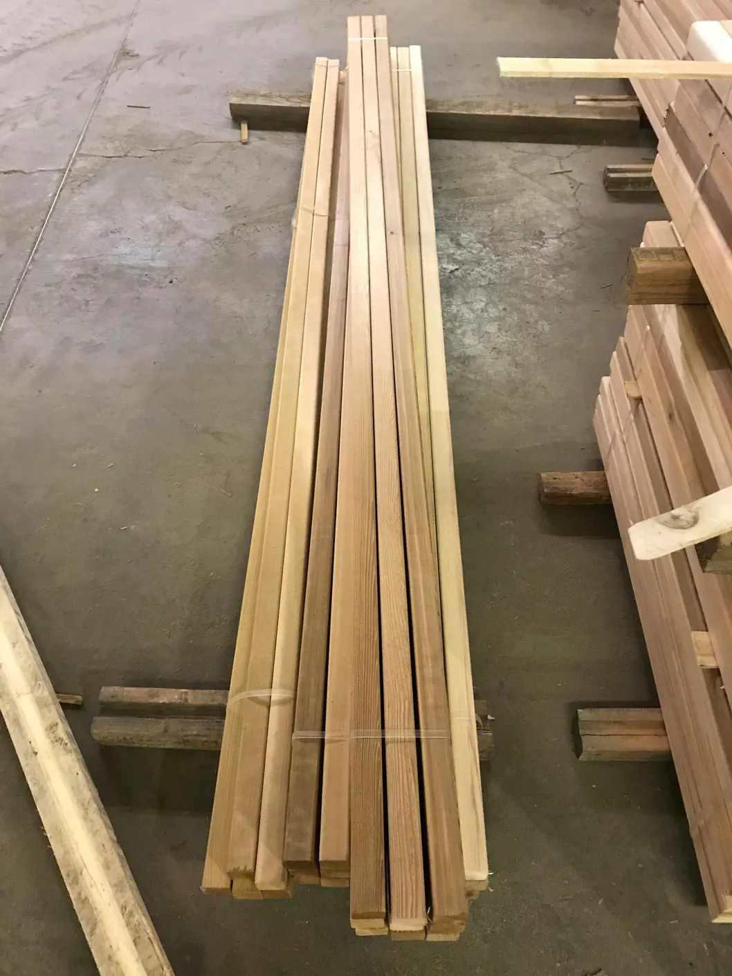Bundled lengths of western red cedar in a lumber warehouse